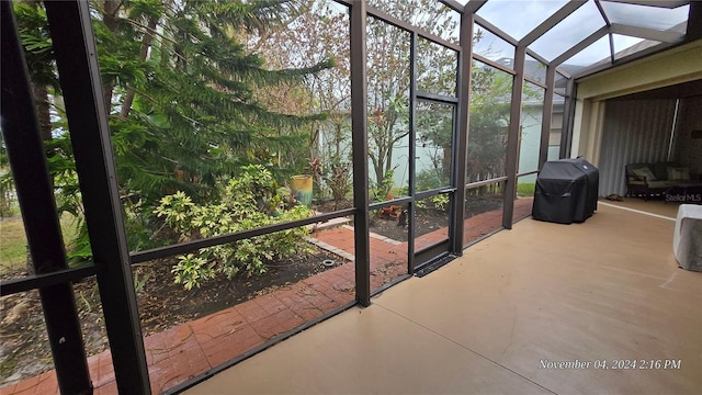 unfurnished sunroom featuring vaulted ceiling