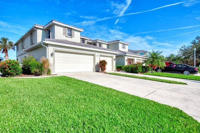 view of front of home featuring a garage and a front yard