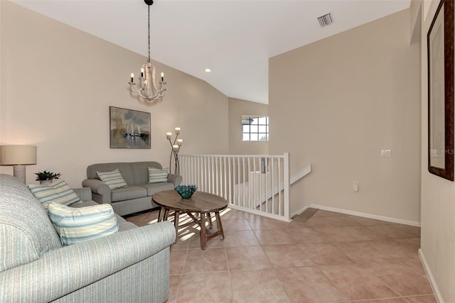 living room with light tile patterned flooring, a chandelier, and vaulted ceiling