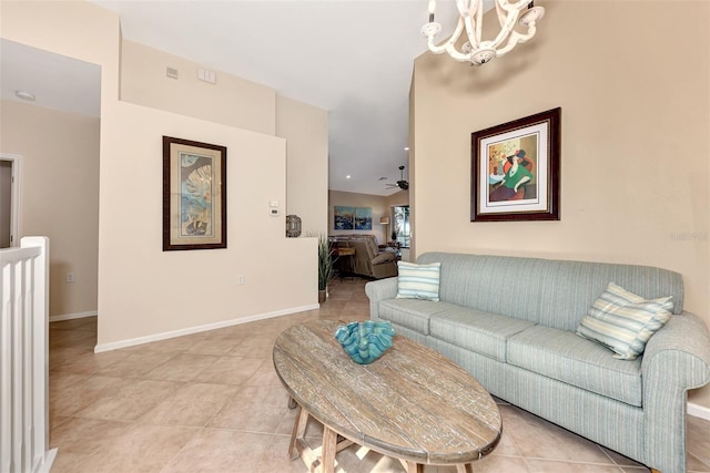 living room featuring ceiling fan with notable chandelier and light tile patterned flooring