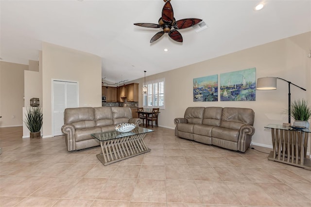 tiled living room featuring ceiling fan