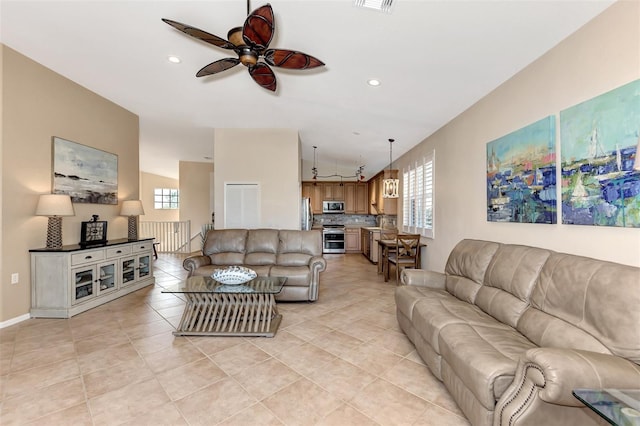 living room featuring light tile patterned flooring and ceiling fan