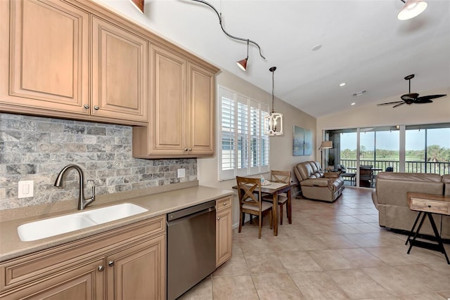 kitchen with sink, tasteful backsplash, dishwasher, pendant lighting, and vaulted ceiling