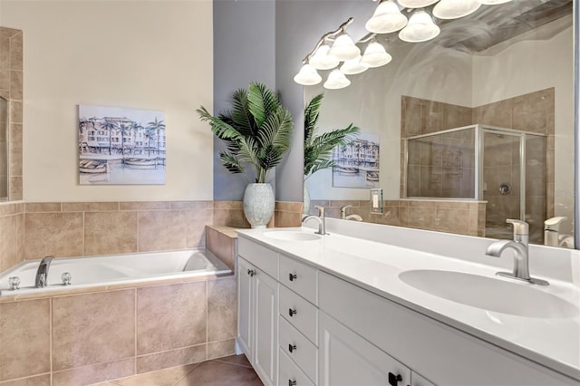 bathroom featuring vanity, tile patterned flooring, and plus walk in shower