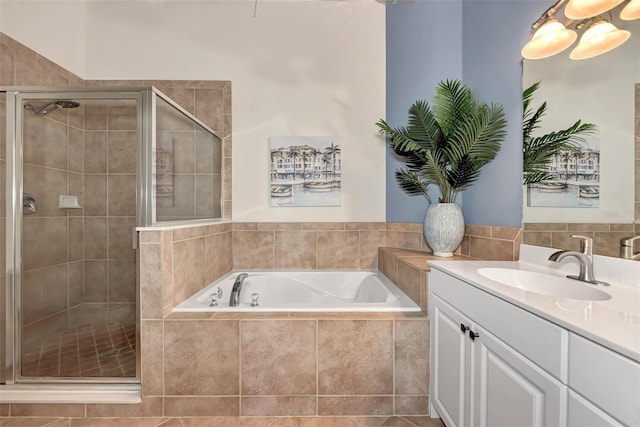 bathroom with vanity and separate shower and tub