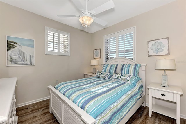 bedroom featuring multiple windows, ceiling fan, and dark hardwood / wood-style floors