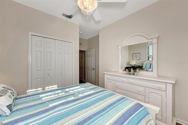 bedroom featuring ceiling fan and a closet