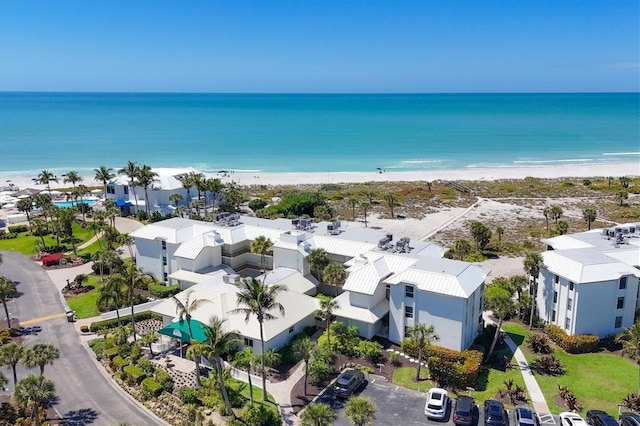 bird's eye view with a view of the beach and a water view