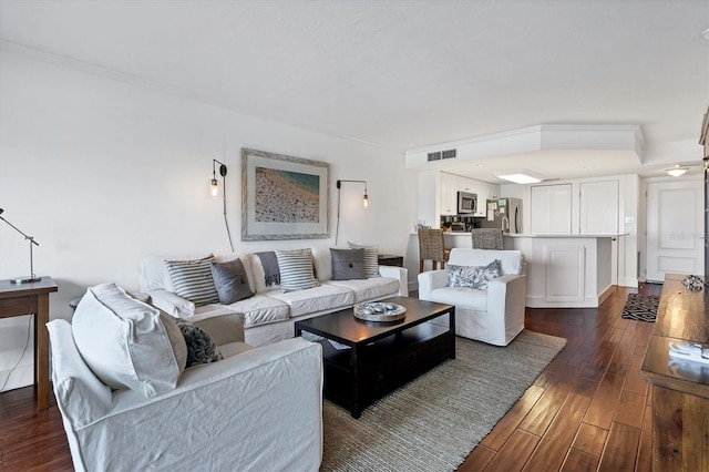 living room featuring dark wood-type flooring