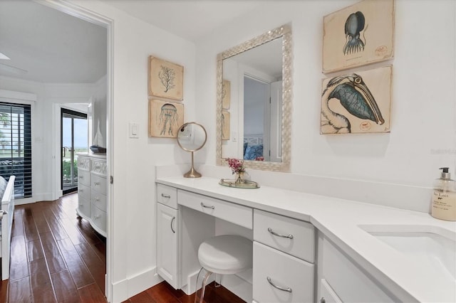 bathroom with hardwood / wood-style floors and vanity