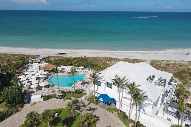 bird's eye view featuring a beach view and a water view