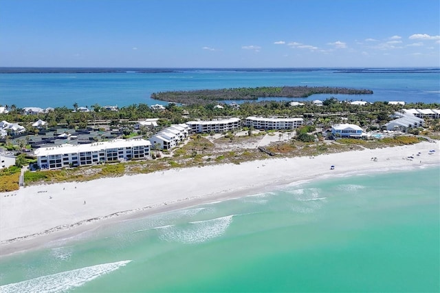 birds eye view of property featuring a view of the beach and a water view