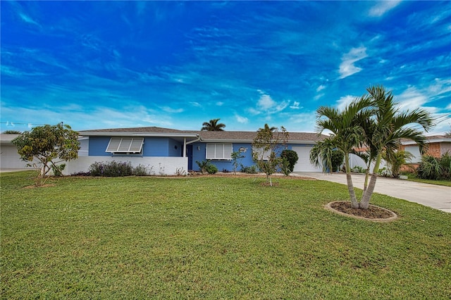 ranch-style house with a garage and a front yard