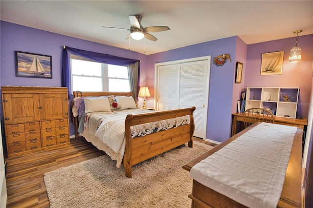 bedroom featuring hardwood / wood-style floors, a closet, and ceiling fan