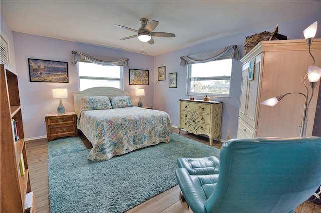 bedroom featuring wood-type flooring and ceiling fan