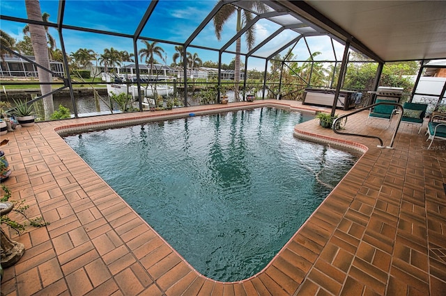 view of swimming pool featuring glass enclosure, a water view, a jacuzzi, area for grilling, and a patio