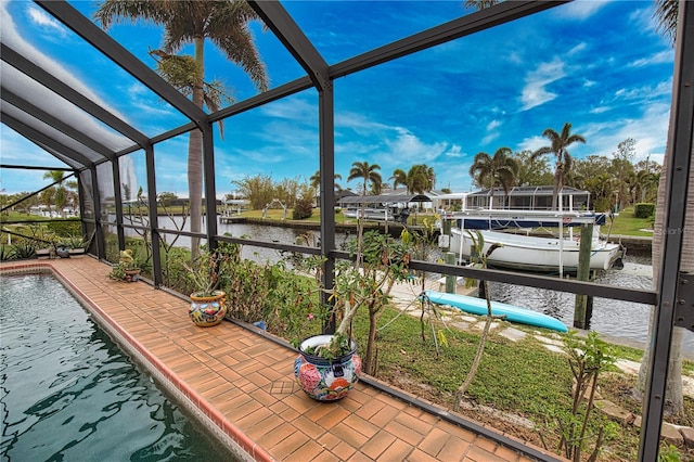 sunroom / solarium with a water view