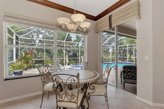 dining area featuring a chandelier, light tile patterned floors, and ornamental molding