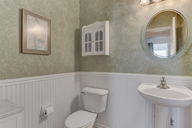 bathroom with sink and toilet