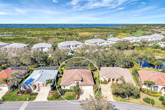 bird's eye view with a water view