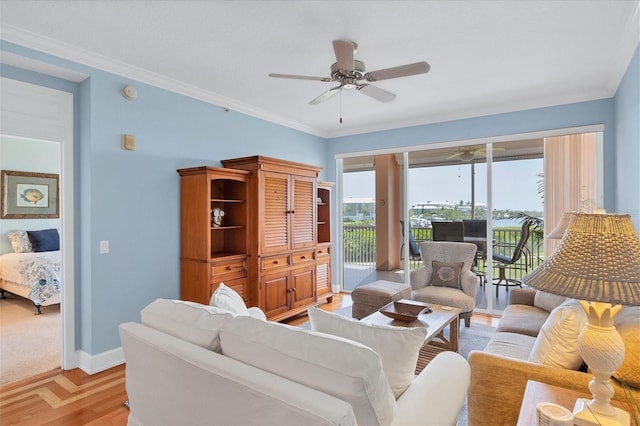 living room with ceiling fan, light hardwood / wood-style floors, and ornamental molding