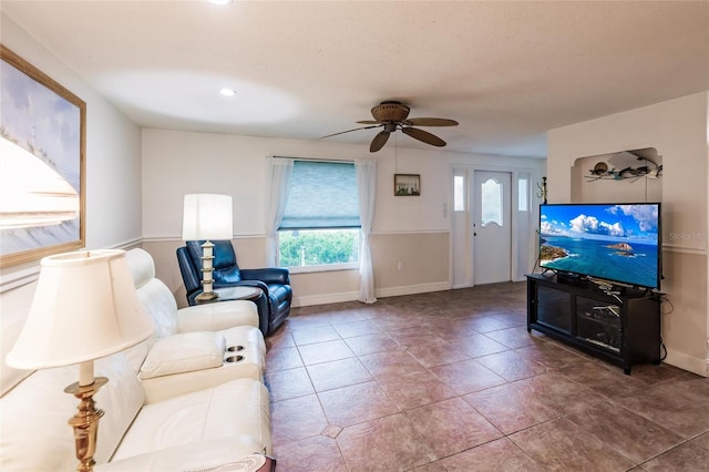 living room with tile patterned flooring, plenty of natural light, and ceiling fan