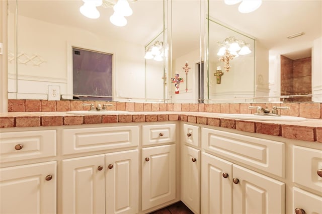 bathroom featuring vanity and tasteful backsplash