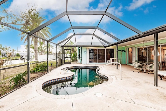 view of pool featuring ceiling fan, a lanai, and a patio