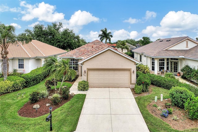 view of front of home featuring a garage and a front yard