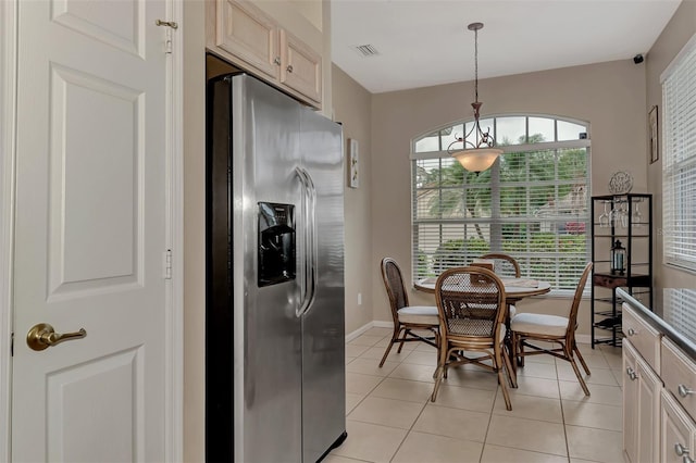 tiled dining area featuring plenty of natural light