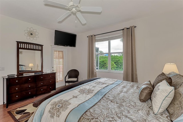 bedroom featuring light hardwood / wood-style floors and ceiling fan