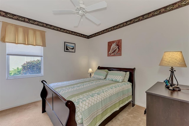 bedroom with ceiling fan and light colored carpet