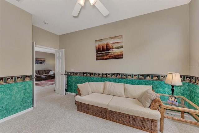 carpeted living room featuring ceiling fan