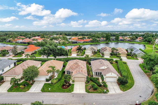 birds eye view of property with a water view