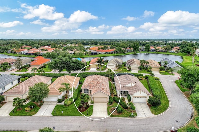 drone / aerial view featuring a water view