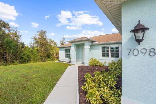 exterior space featuring a front yard