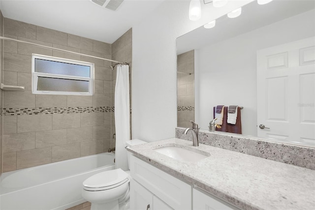 full bathroom featuring vanity, toilet, and shower / tub combo