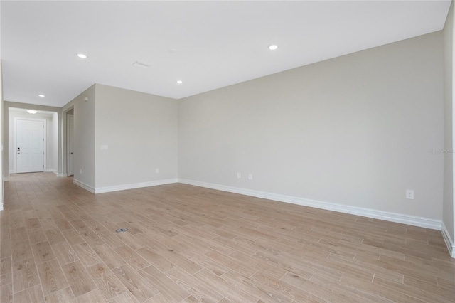 unfurnished room with light hardwood / wood-style floors