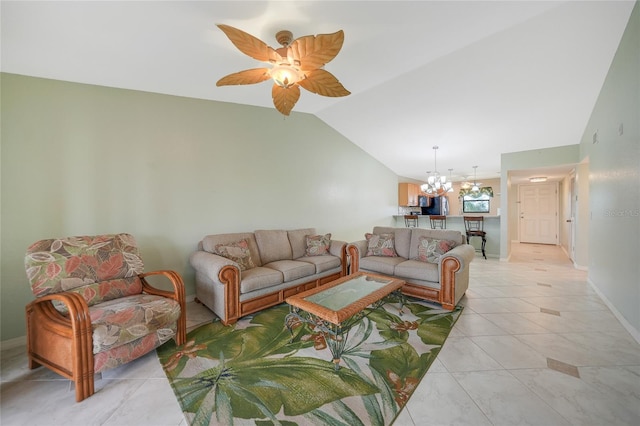 tiled living room with lofted ceiling and ceiling fan with notable chandelier