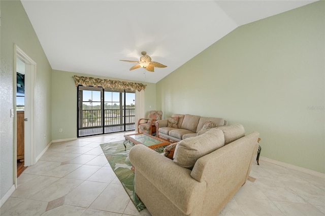 living room featuring vaulted ceiling, light tile patterned floors, and ceiling fan