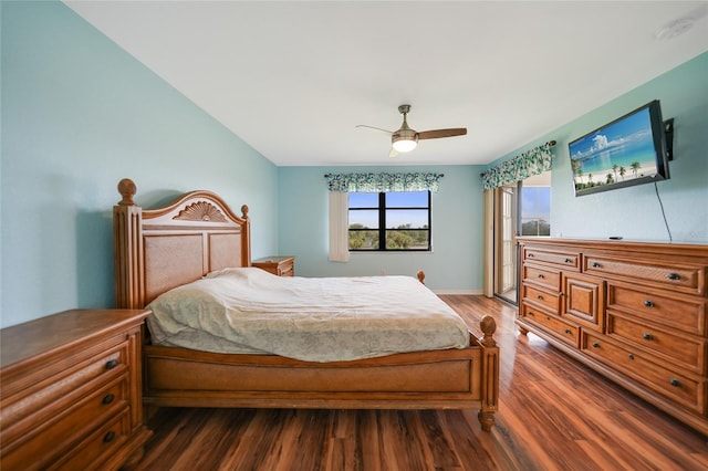 bedroom with ceiling fan and dark hardwood / wood-style flooring