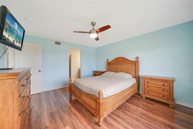 bedroom featuring dark hardwood / wood-style floors and ceiling fan