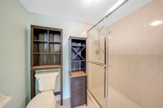 bathroom featuring walk in shower and toilet