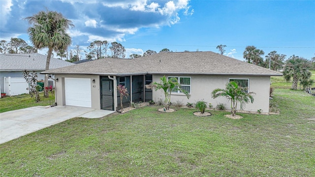 view of front of house featuring a garage and a front lawn