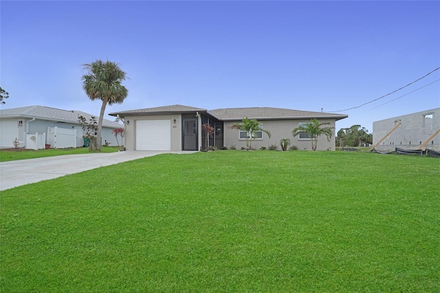 ranch-style house with a garage and a front lawn