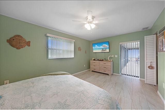 bedroom with access to outside, multiple windows, and ceiling fan