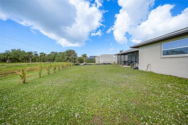 view of yard featuring a sunroom