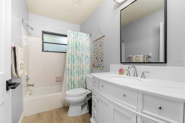 full bathroom featuring shower / tub combo with curtain, vanity, hardwood / wood-style floors, and toilet