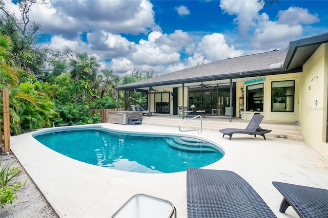 view of swimming pool featuring a hot tub, a patio, and ceiling fan