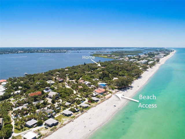 aerial view featuring a beach view and a water view